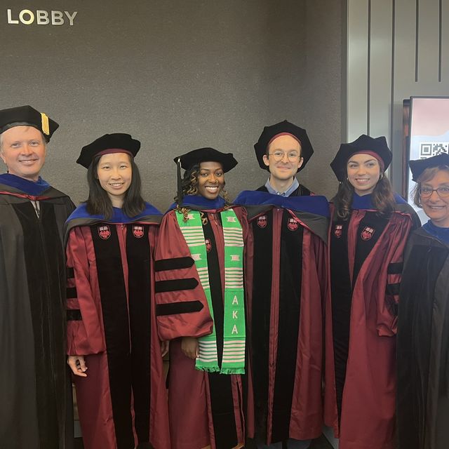 Dr. Glenn Randall with graduating COM students in 2023